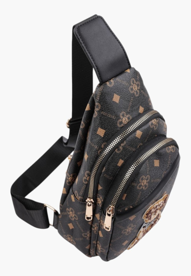 Falio women's multi-colored faux leather sling backpack with monogram pattern, multiple zippers, and black strap