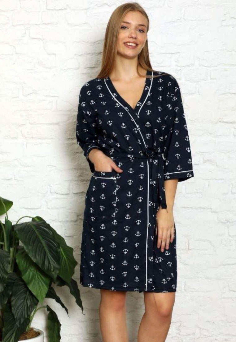 Falio cotton robe in navy blue with white anchor print, short sleeves, and tie waist, worn by a smiling woman.