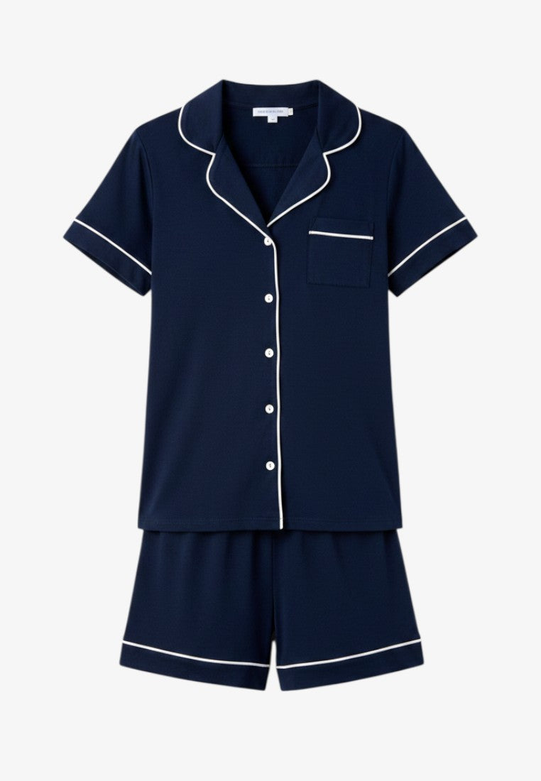 Falio navy blue cotton pajama set with short sleeves, white piping detail, and button-down shirt with matching shorts.