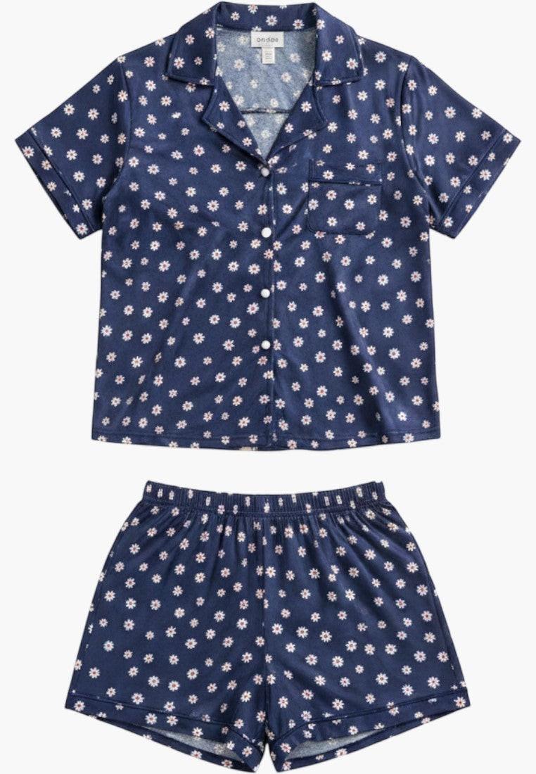 Falio navy blue 100% cotton pajama set with white daisy print, short sleeves, collar, and button-up top with short shorts.