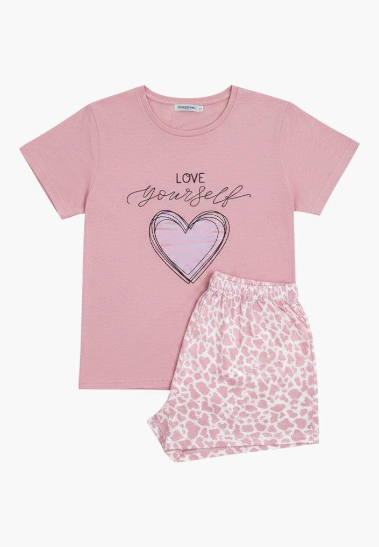 Falio pink cotton plus size pajama set with short sleeves, round neck, and heart graphic. Features 3/4 length shorts with a leopard print.