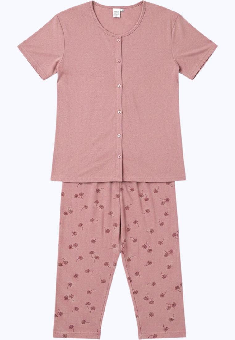 Falio plus size women's pink 100% cotton pajama set with short sleeves, button-up top, and floral print capri pants.