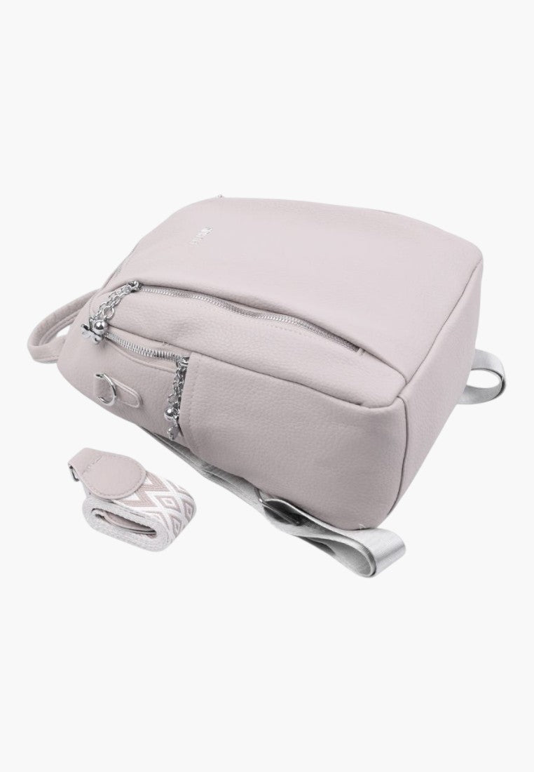 Falio urban women's backpack in light pink faux leather with A4 capacity, multiple pockets, and patterned straps.