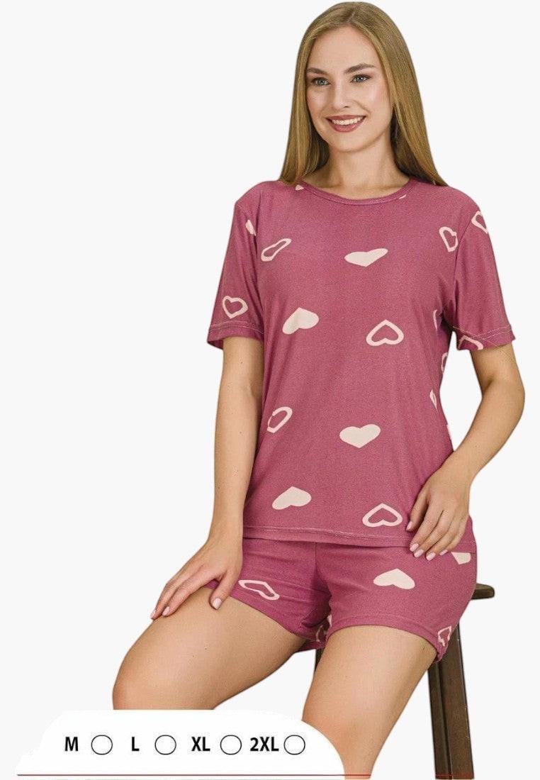 Falio women's pink cotton pajama set with a heart print. Features a short-sleeve top and matching shorts.