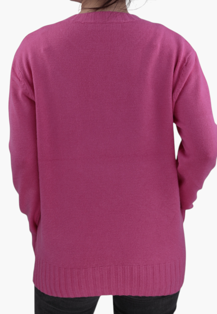 Back view of a Falio pink long-sleeve sweater with a round neckline and ribbed hem, worn by a woman.