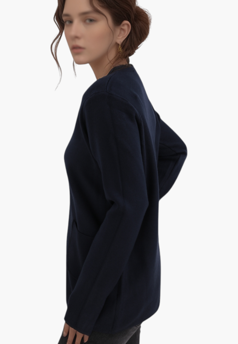Falio plus size navy blue viscose sweater with long sleeves, round neckline, and side pockets on a female model