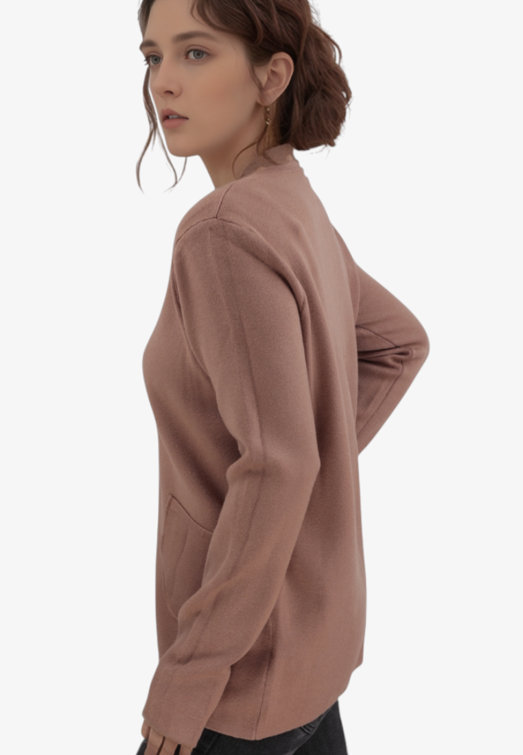 Falio plus size long sleeve viscose sweater in dusty rose with side pockets and round neckline on a model