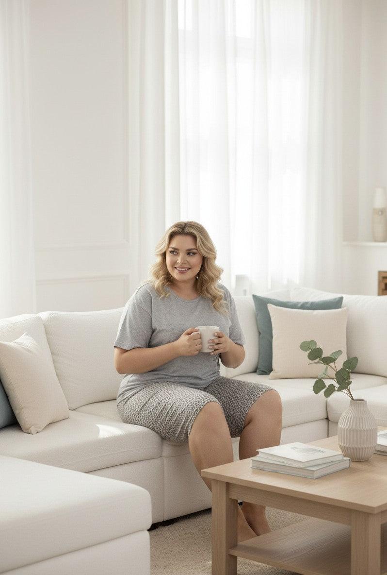 Falio grey 100% cotton plus size women's pajama set with short sleeves and 3/4 length leopard print shorts, adorned with butterfly detail.