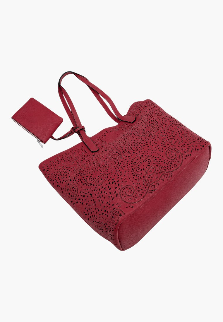 Falio red faux leather shopper bag with intricate laser-cut floral patterns and a matching small zip pouch