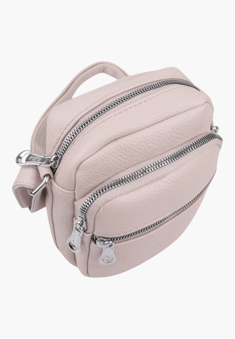 Falio small light pink faux leather crossbody bag with multiple zippered compartments and silver hardware