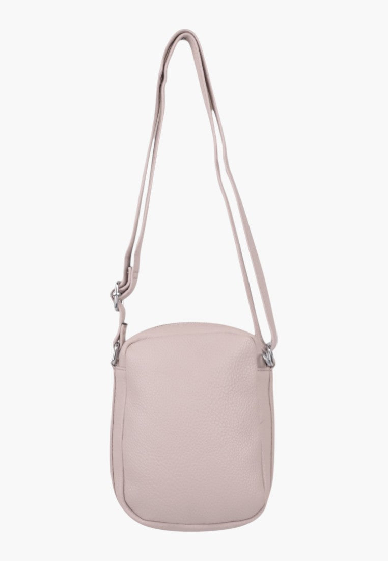Falio small light pink faux leather crossbody bag with an adjustable shoulder strap and zip closure