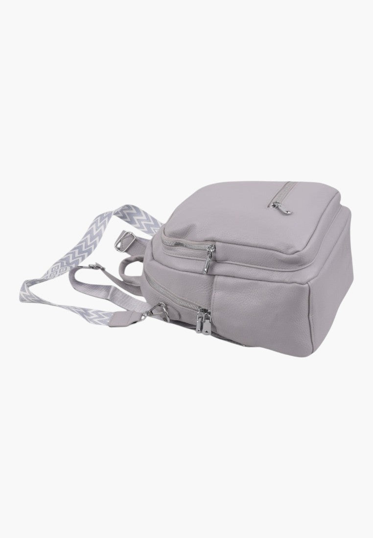 Falio stone grey urban women's backpack with patterned straps and silver zippers, shown from a side angle.