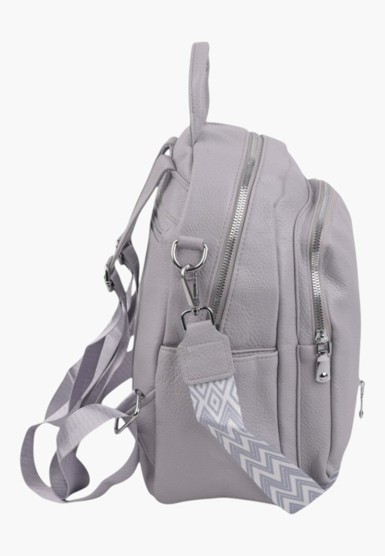 Falio stone grey urban women's backpack with silver zippers and a patterned detachable strap, side view.
