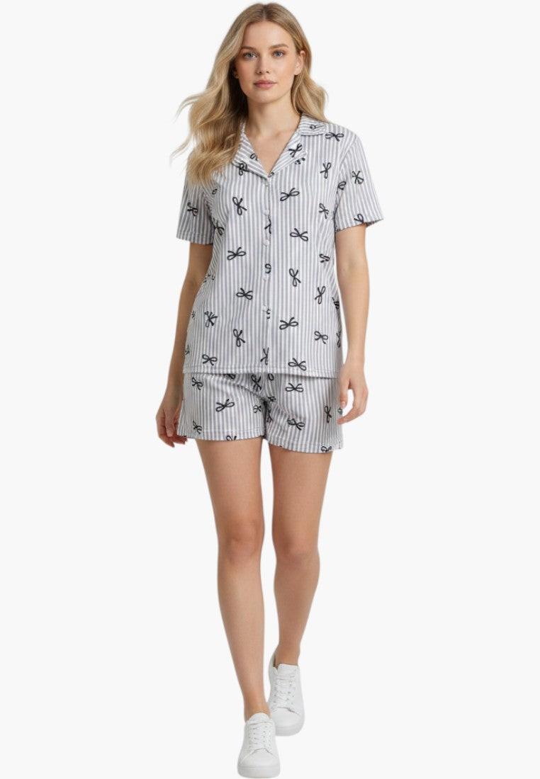 Falio women's grey and white striped 100% cotton pajama set with black bow print. Features short sleeves, V-neck, button-up top, and short shorts.