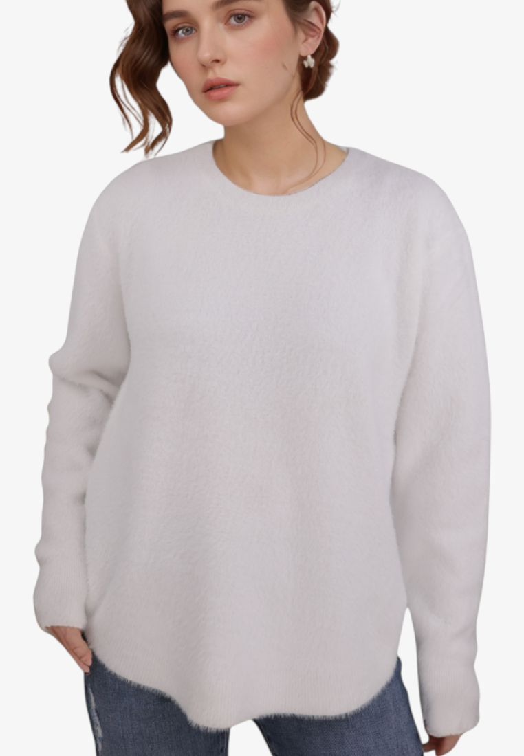 Model wearing a white Falio wool-blend sweater with long sleeves and a soft texture against a plain background