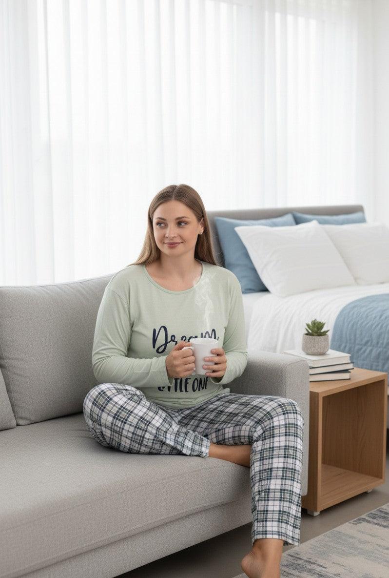 Falio plus size women's light green long-sleeve 100% cotton pajama set with 'Dream Big Little One' graphic and plaid pants.