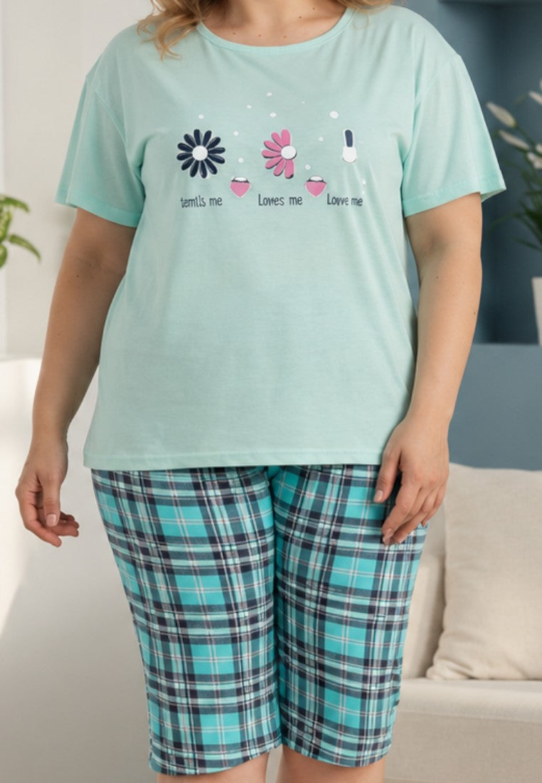 Falio women's cotton pajama set with a mint green short-sleeve top featuring floral print and plaid capri pants.