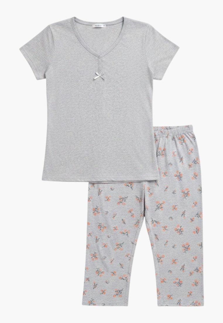 Falio women's grey cotton pajama set with short sleeves and floral print 3/4 pants. Round neck with button detail.