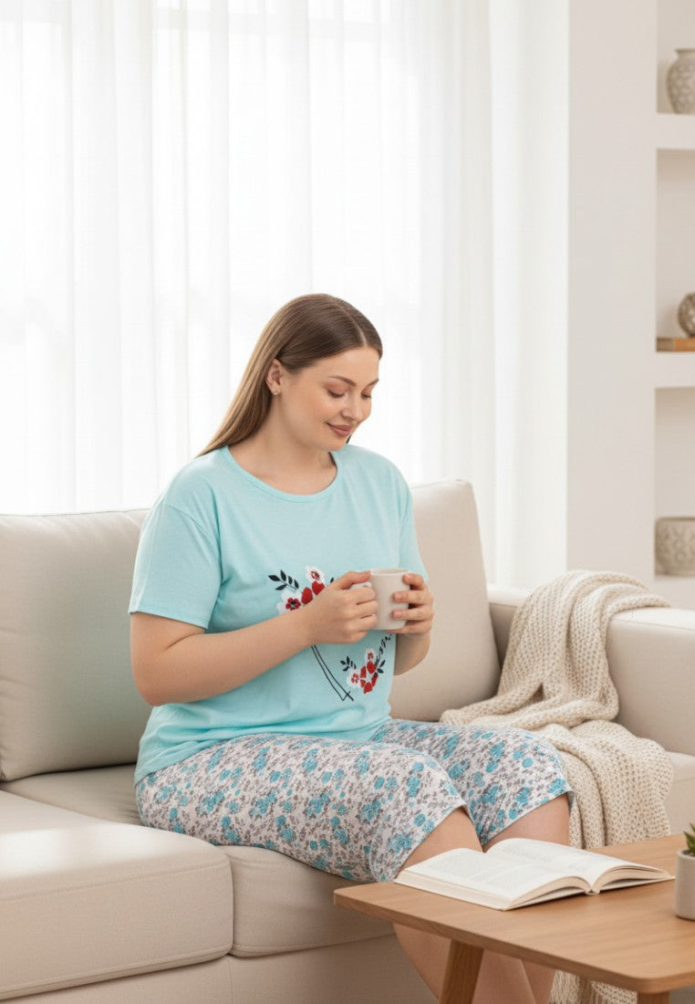 Falio light blue 100% cotton women's pajama set with heart and floral graphic on top and floral print shorts.