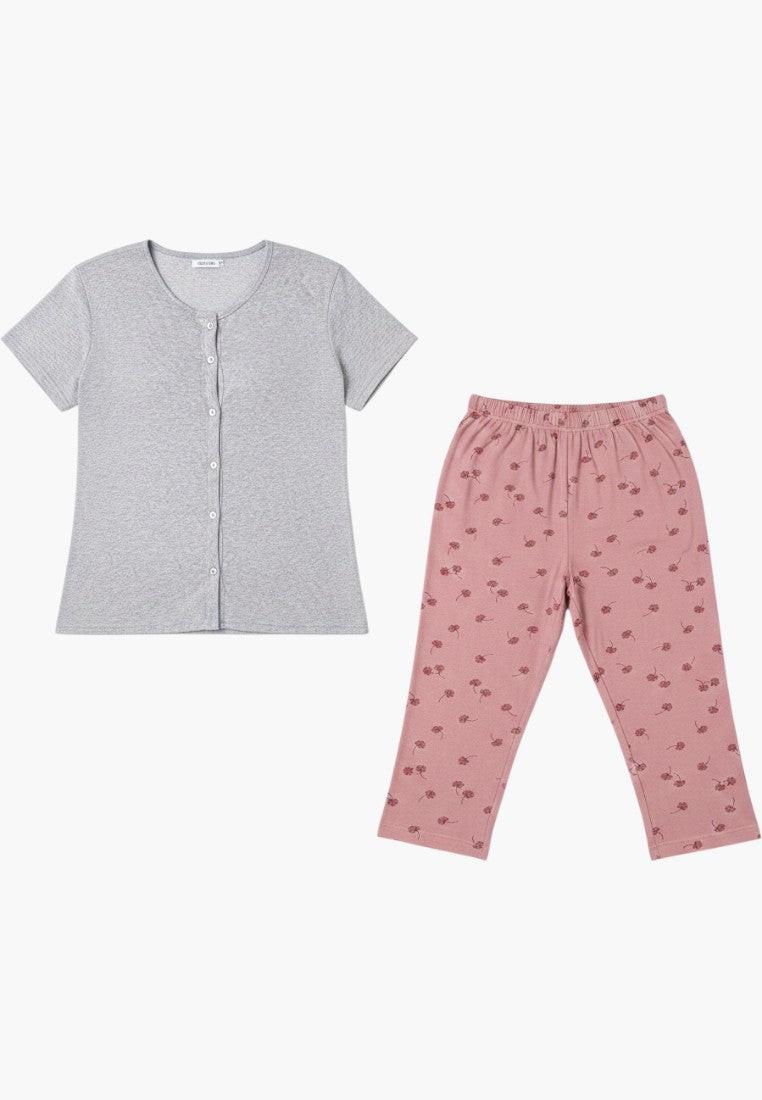 Falio women's plus size 100% cotton pajama set with short sleeves, round neck, button front, and floral print 3/4 capri pants in pink and grey.