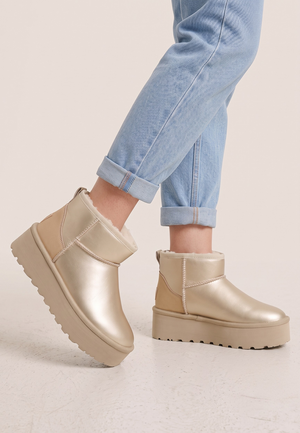 Falio yellow metallic faux leather slip-on ankle boots with warm lining and thick platform sole worn with jeans