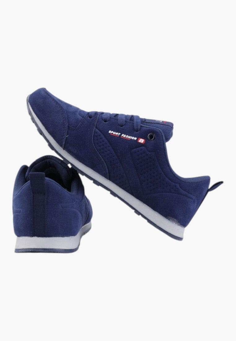 Widok z boku granatowych butów damskich sportowych w stylu slip-on.