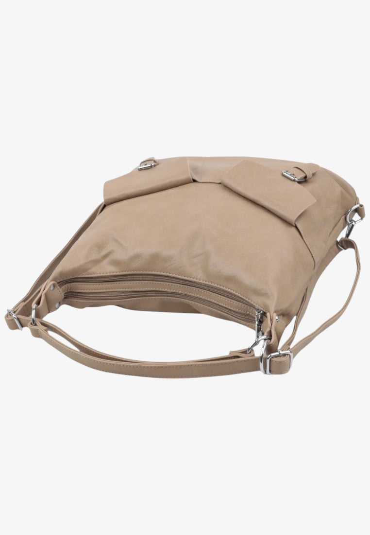 Detail close-up of the beige handbag highlighting stitching details and adjustable strap on a white background.