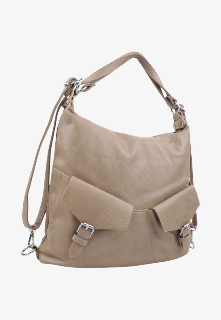 Side view of the beige handbag with two front pockets and shoulder strap on a white background.