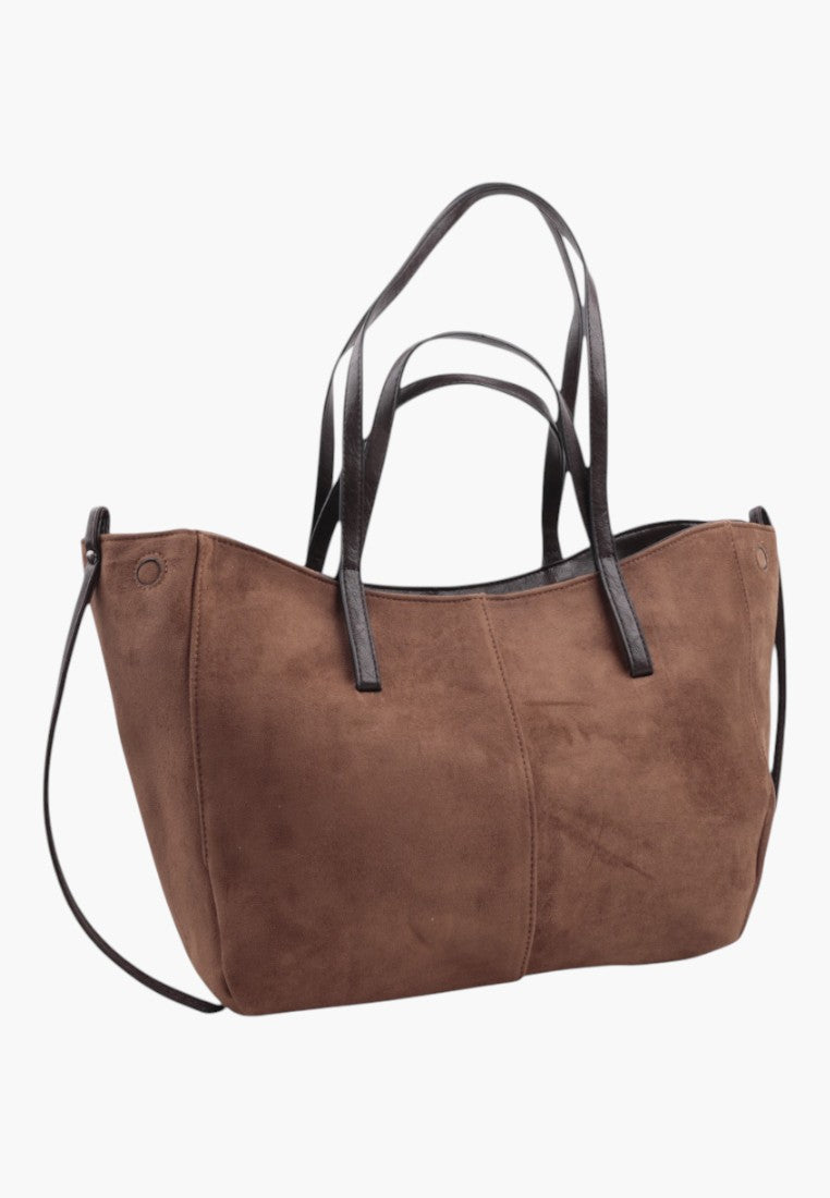 Side view of khaki faux suede shopper bag featuring dark brown handles.