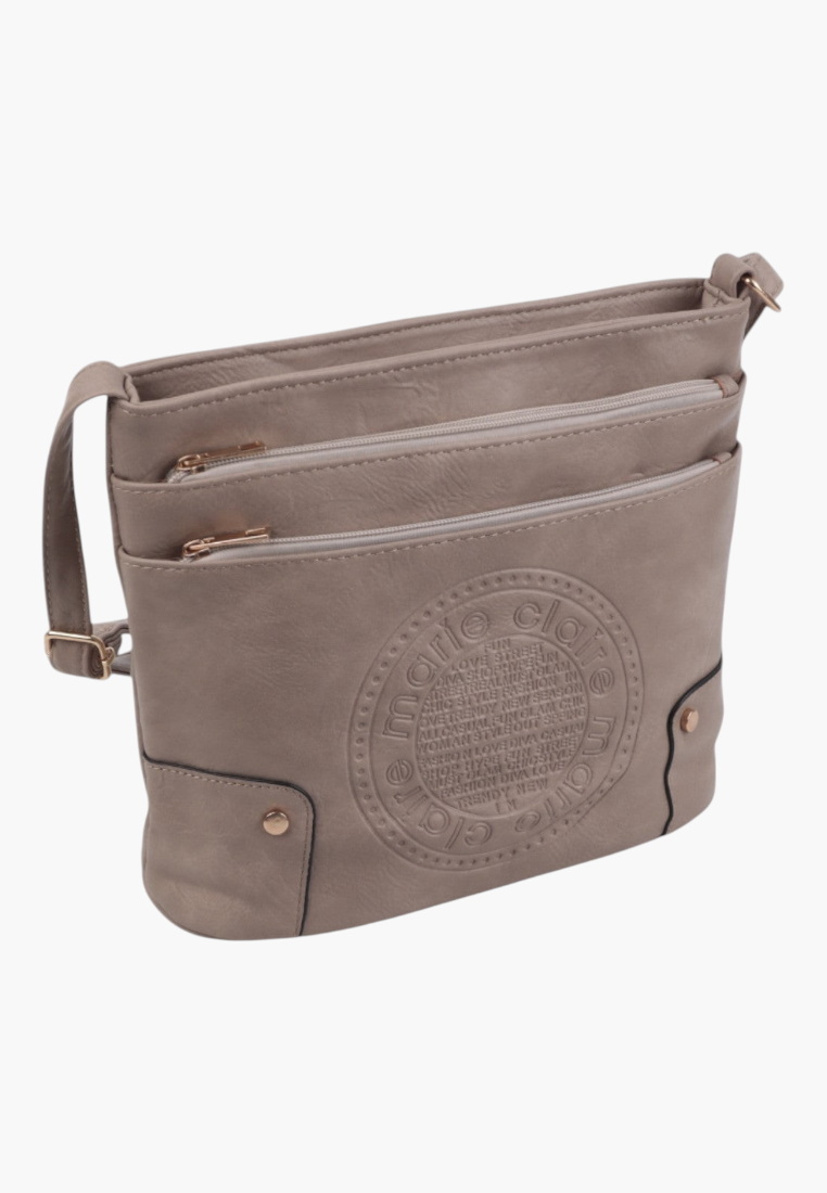 Side view of khaki faux leather crossbody bag showing three front pockets.