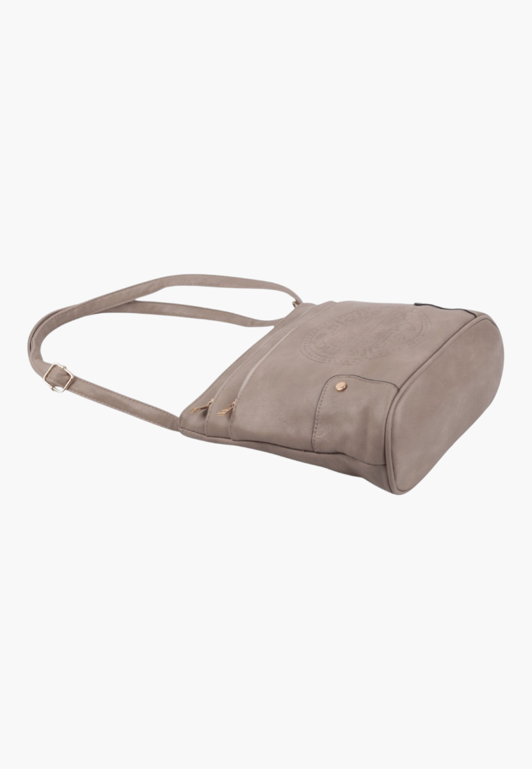 Side view of khaki faux leather crossbody bag with adjustable strap.