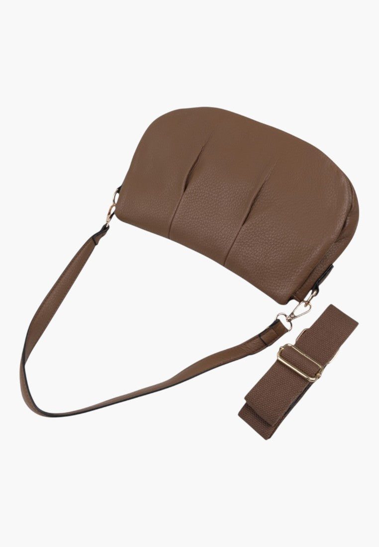 Other angle of the brown handbag highlighting the adjustable strap and zipper closure on a white background.