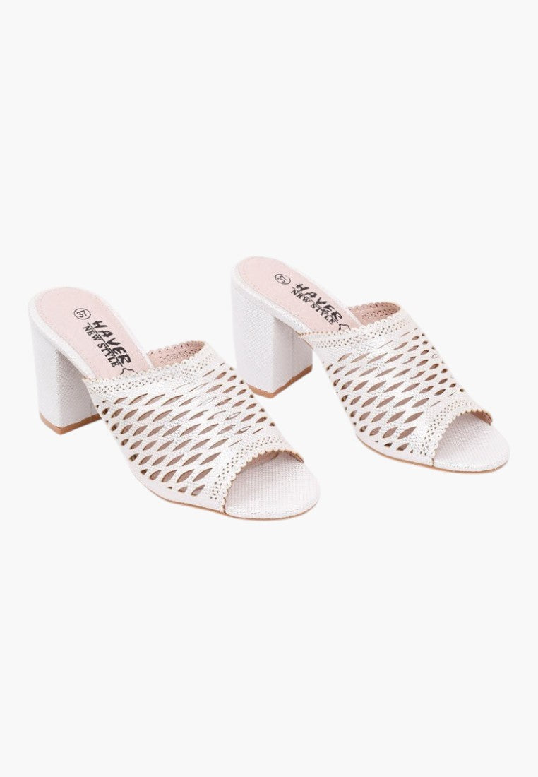 Front view of white heeled sandals with open toe and chunky heel on a white background