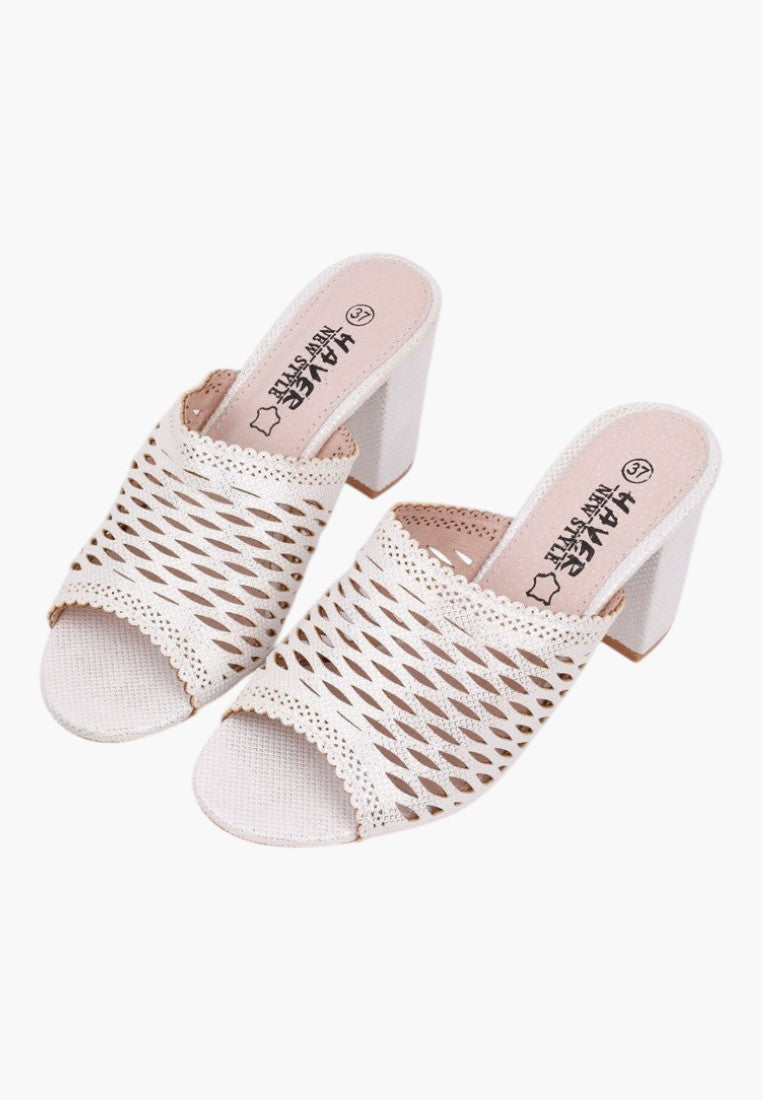 Front view of white heeled sandals featuring woven design and open toe on a white background