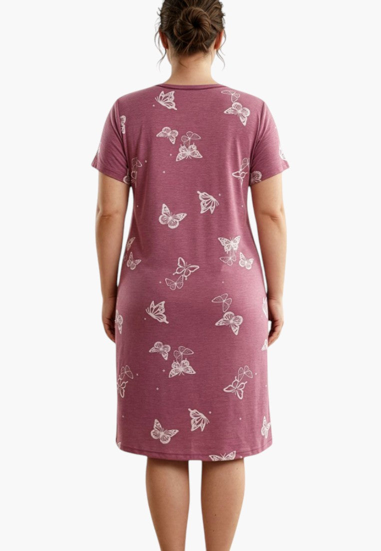 Lifestyle shot of a floral dress with purple and white colors, featuring short sleeves and a round neckline.