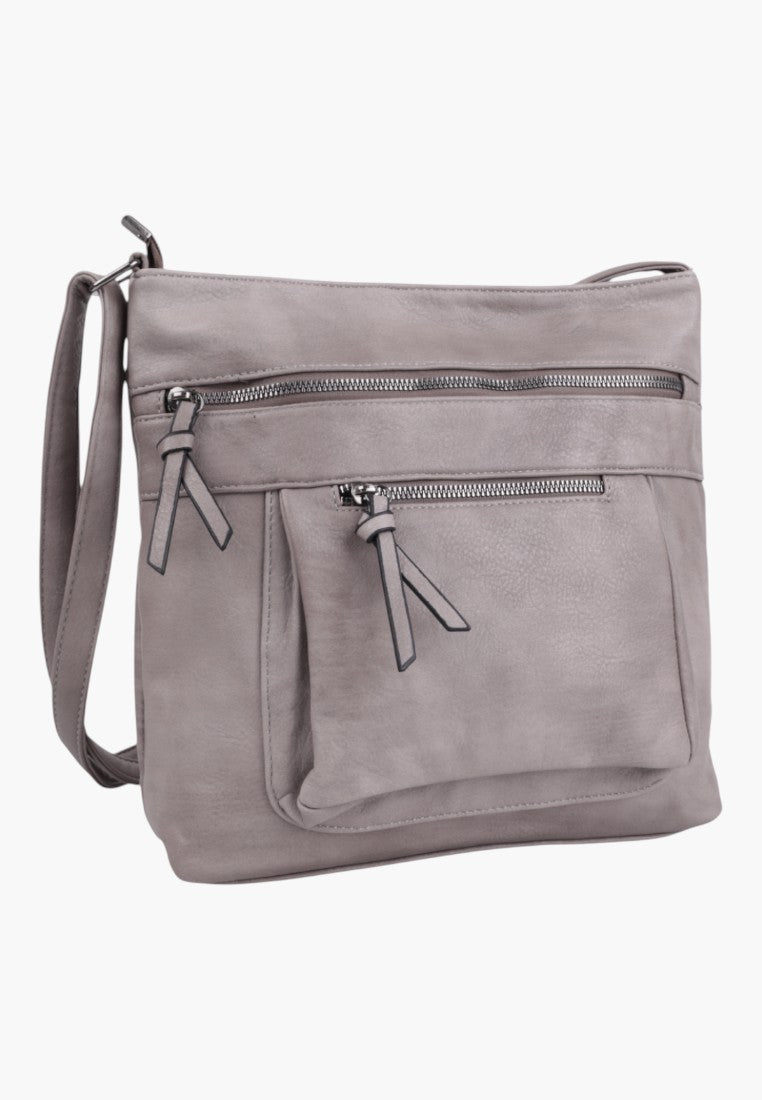 Front view of a light grey faux leather crossbody bag with multiple zippered pockets.