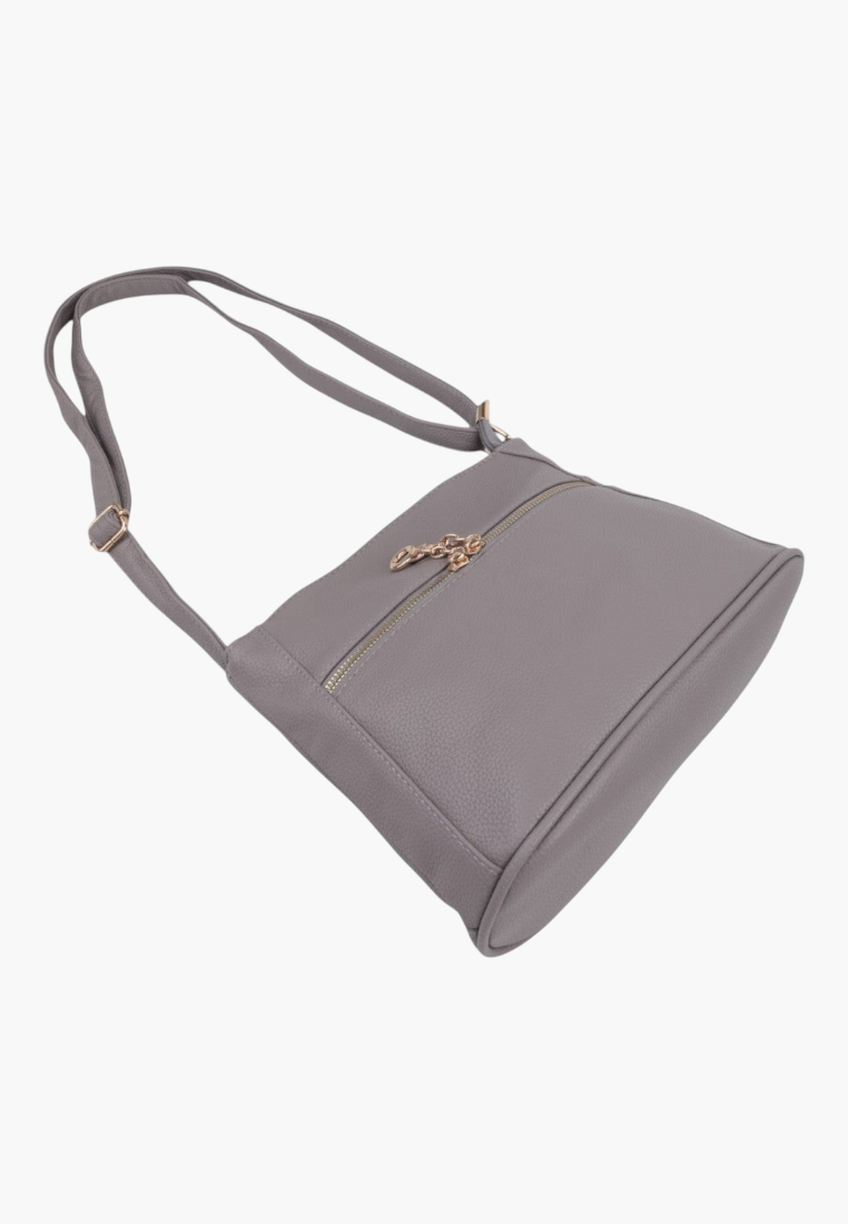 Detail shot of a gray handbag showing zipper closure and flat base.