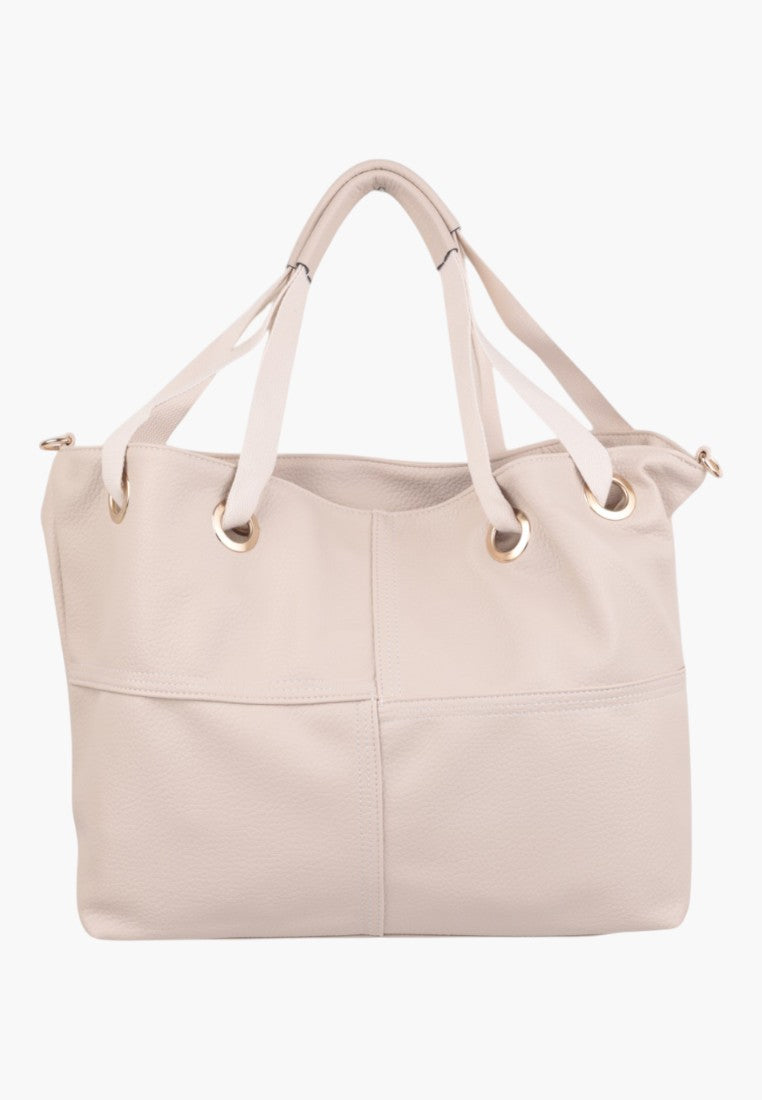 Front view of a light pink handbag with two handles.