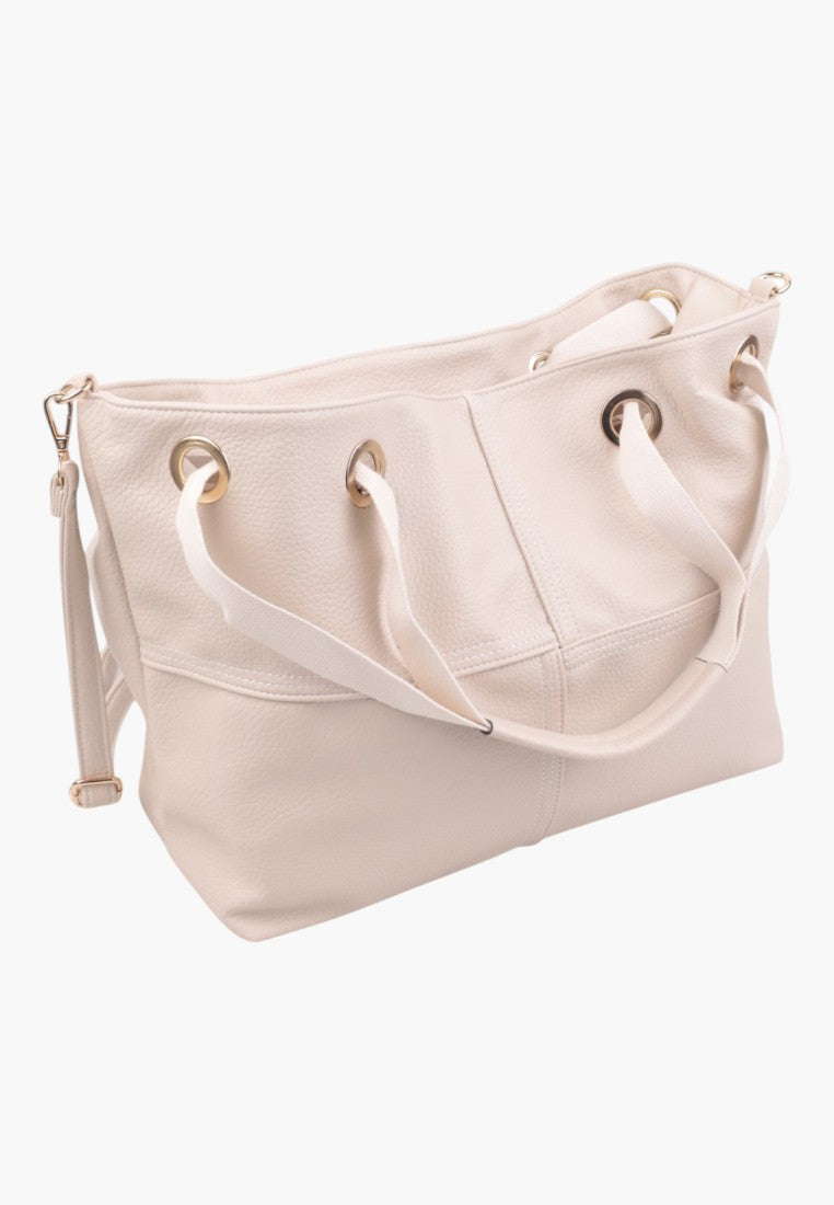 Side view of a light pink handbag featuring a pleated design.