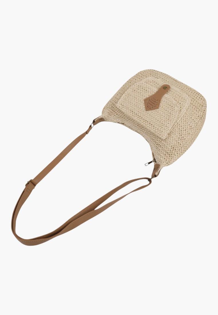 Back view of a beige crossbody bag with a plain back and adjustable strap.