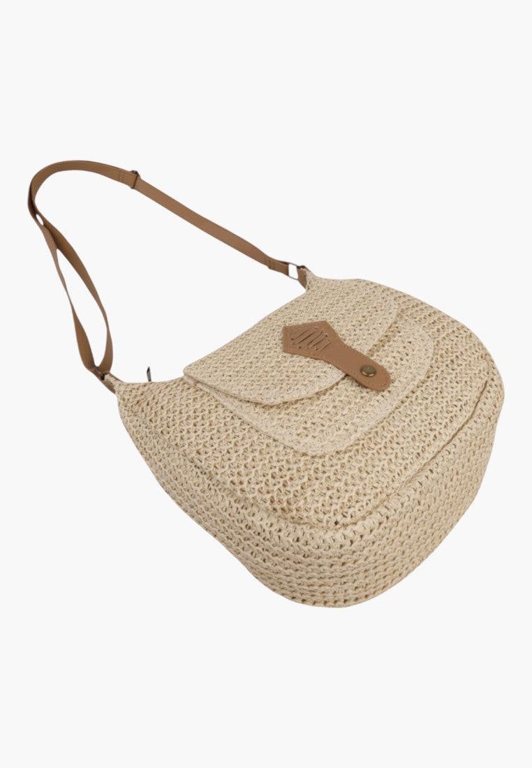Side view of a beige handbag with a shoulder strap and top closure.