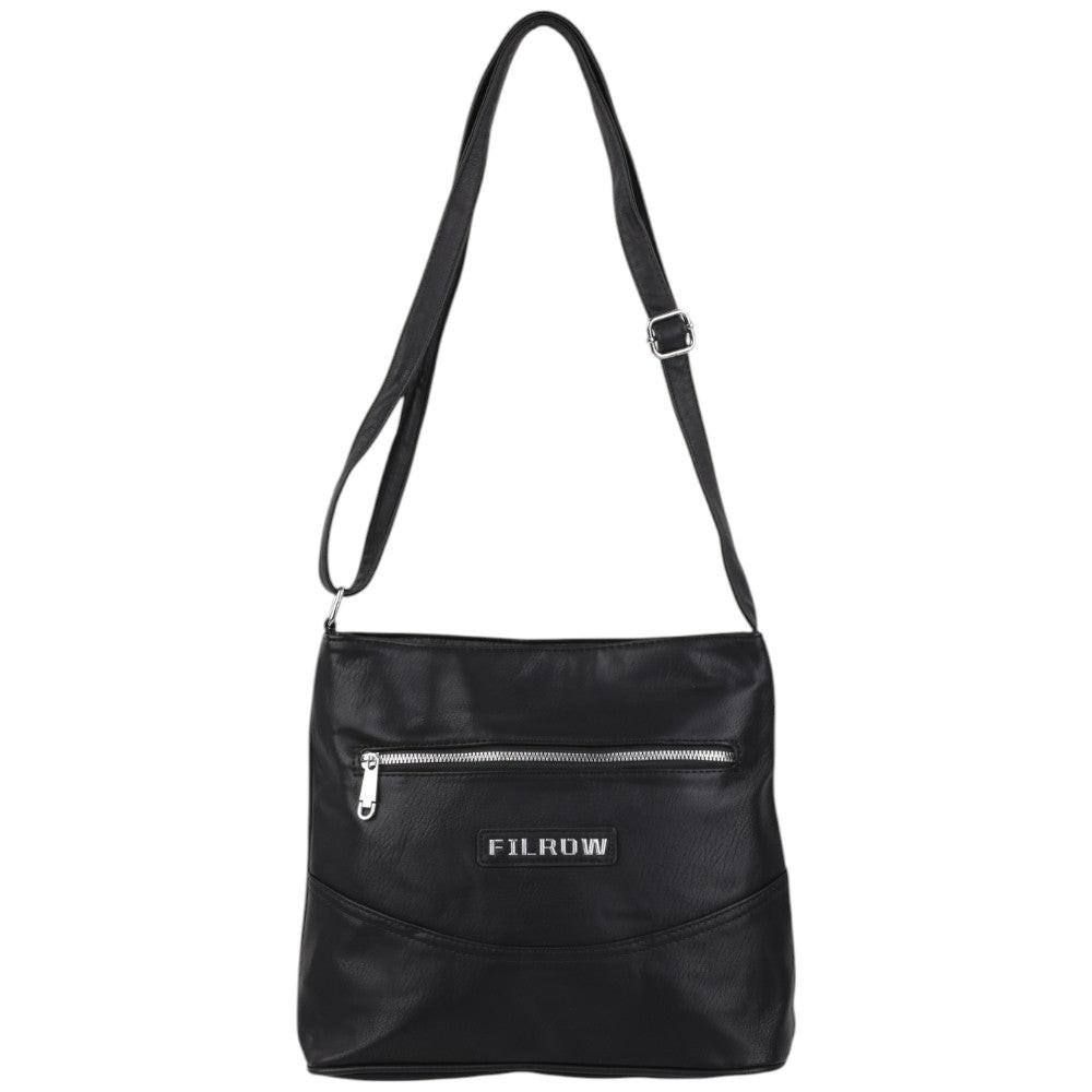 Bottom view of a black handbag with an adjustable strap.