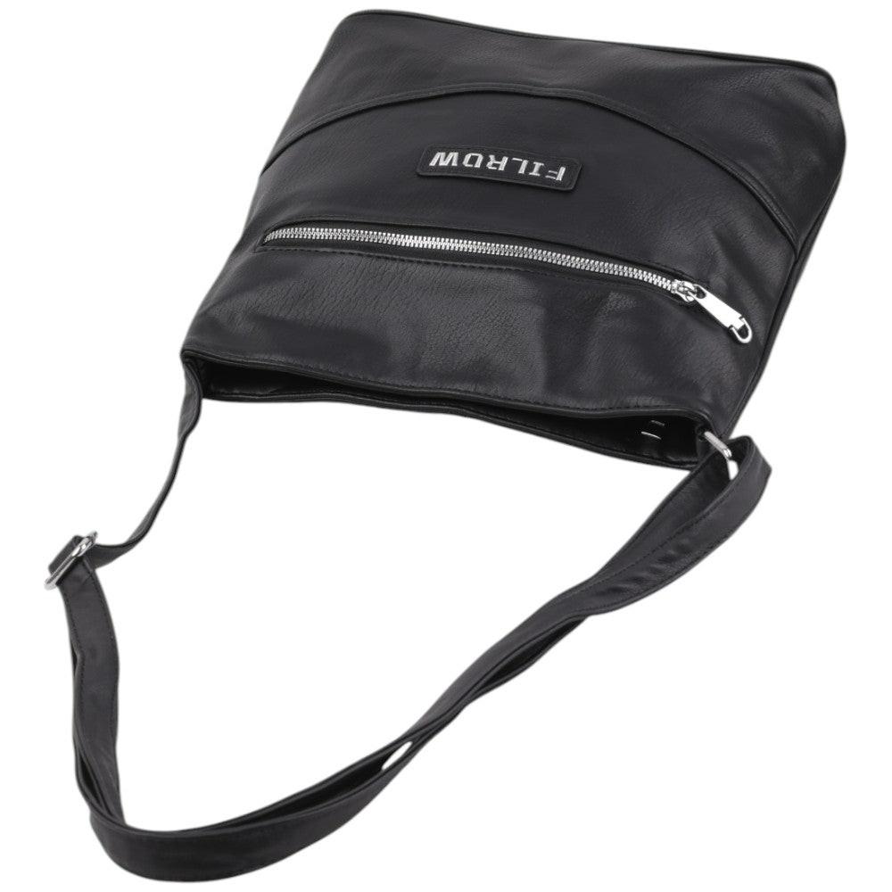 Close-up detail of a black handbag highlighting the smooth finish and zipper pocket.