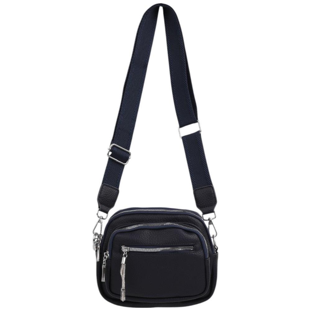 Interior view of a black crossbody bag with multiple compartments and a lined interior.