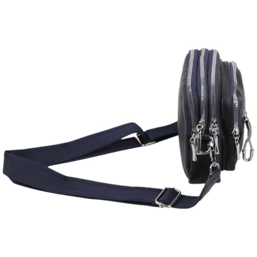 Side view of a navy crossbody bag showcasing a slim profile and durable material.
