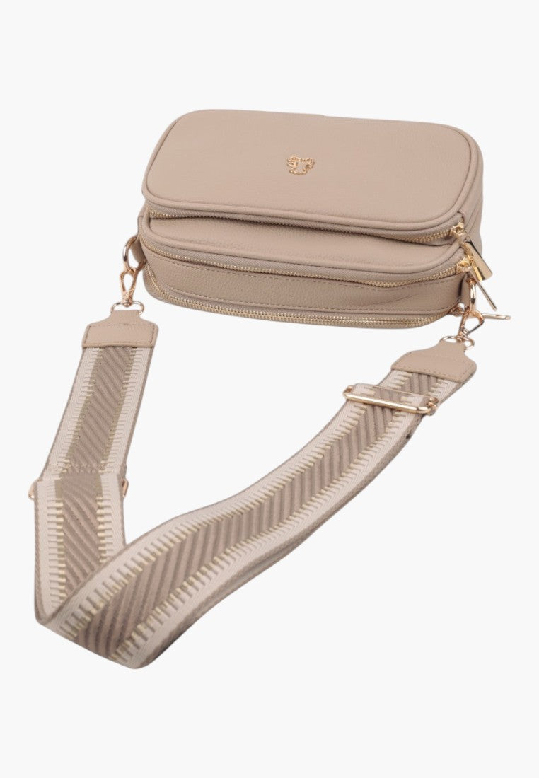 Front view of a khaki handbag with detachable strap and zipper closure.