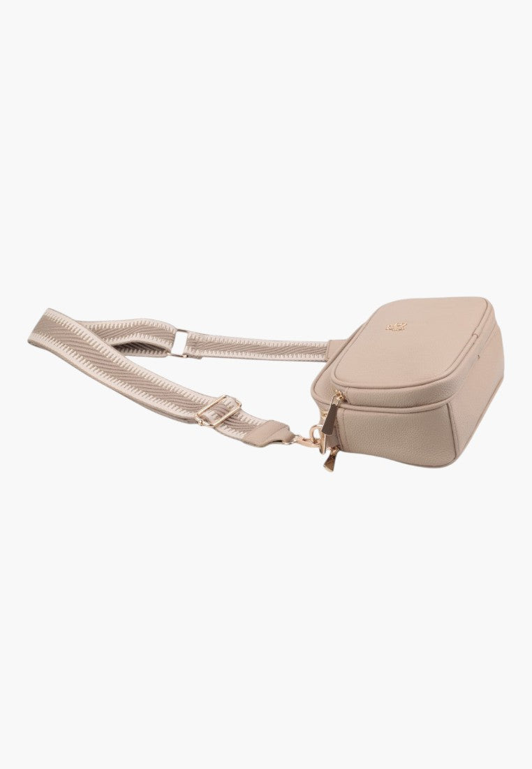 Side view of a khaki handbag with adjustable strap and zipper closure.