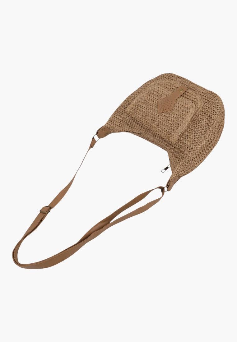 Detail shot of the interior view of the brown woven handbag showcasing its texture.