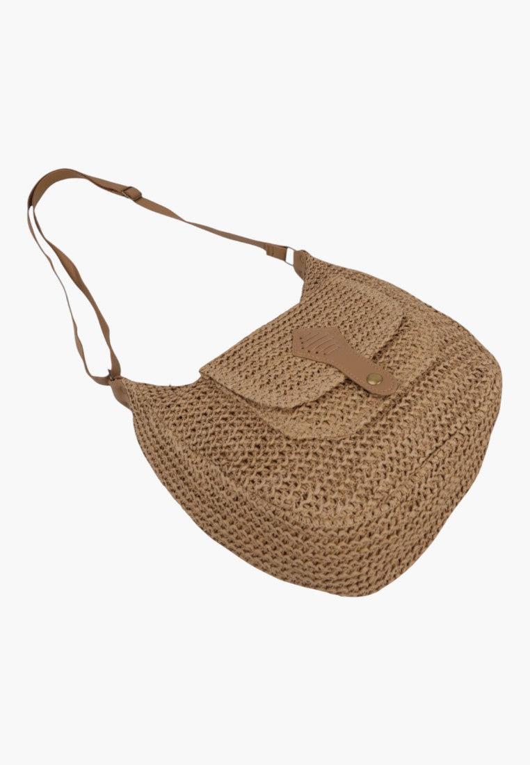 Side view of a brown shoulder bag with a single strap and textured fabric.