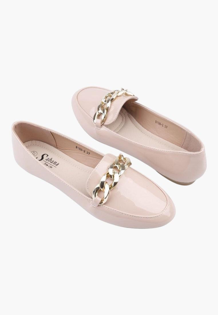 Front view of pink slip-on shoes with gold chain detail on a white background.